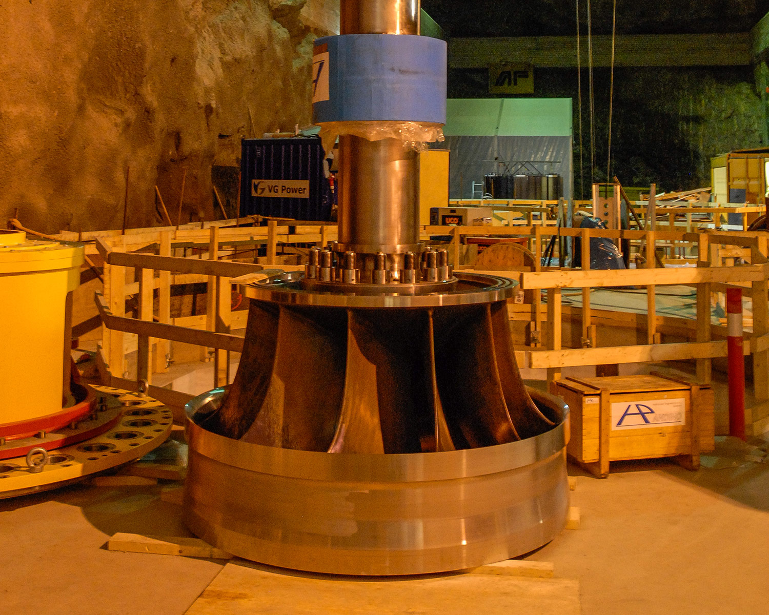 The shaft of the one Francis turbine towers inside the cavern